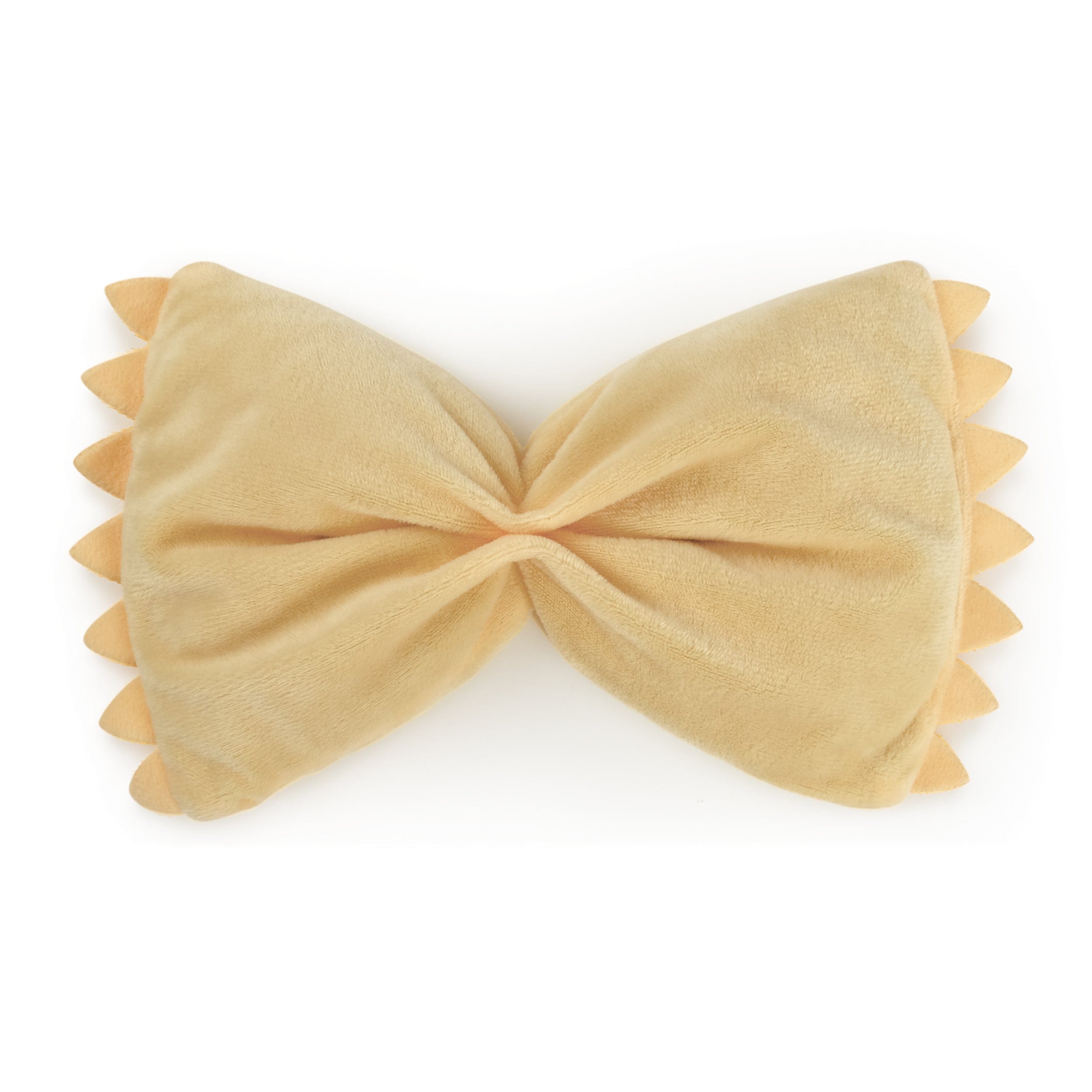 A plush eye pillow that looks like a piece of farfalle pasta.