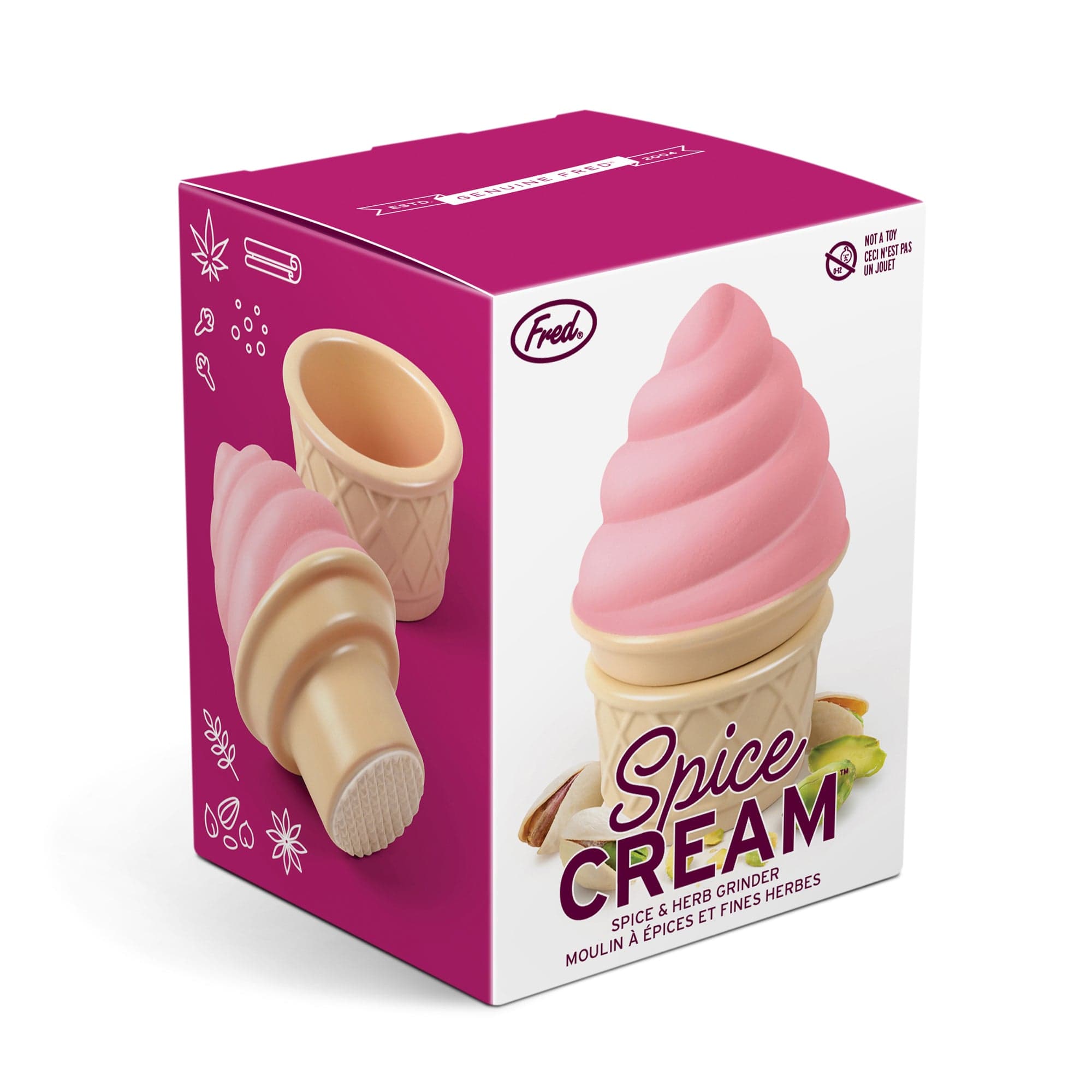 A ceramic spice and herb grinder that looks like strawberry soft serve ice cream in a cone. In packaging.