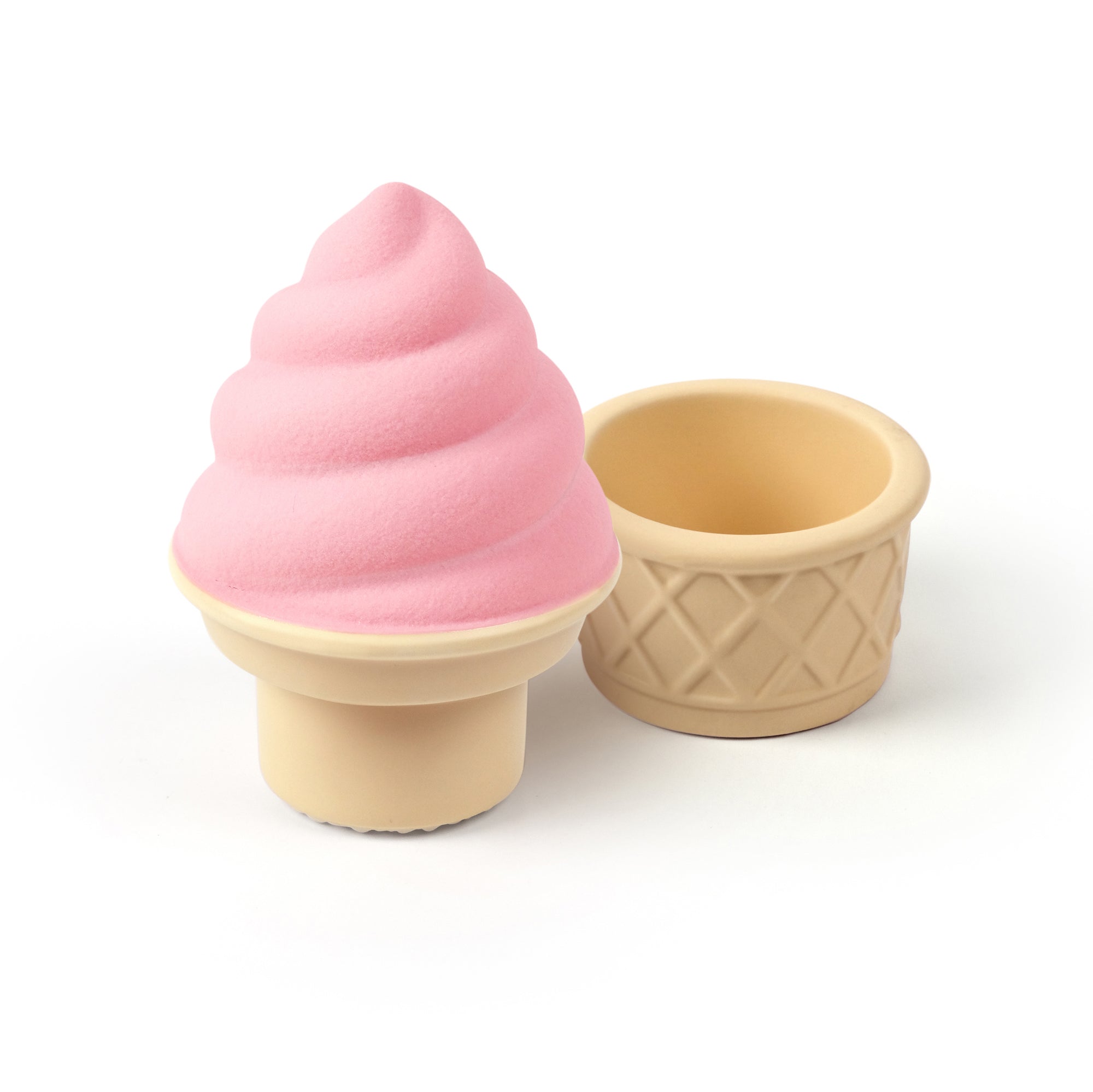 A ceramic spice and herb grinder that looks like strawberry soft serve ice cream in a cone.