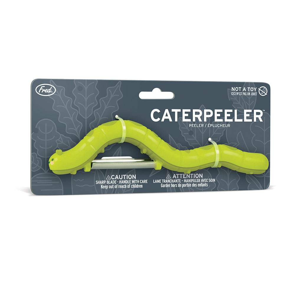 A fruit & vegetable peeler that looks like a green caterpillar, shown on backer card packaging