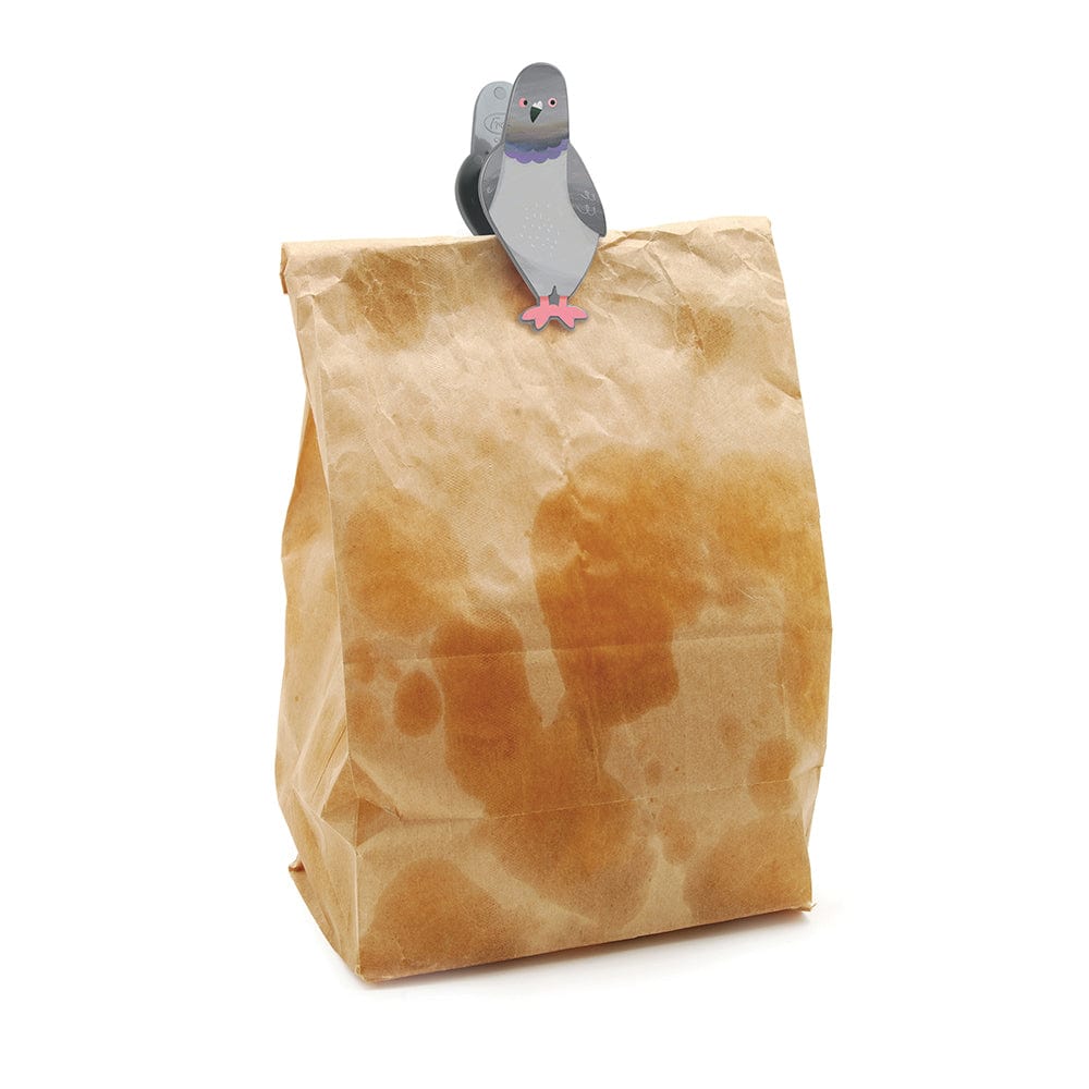 A bag clip that looks like a pigeon sitting on top of a greasy brown lunch bag.