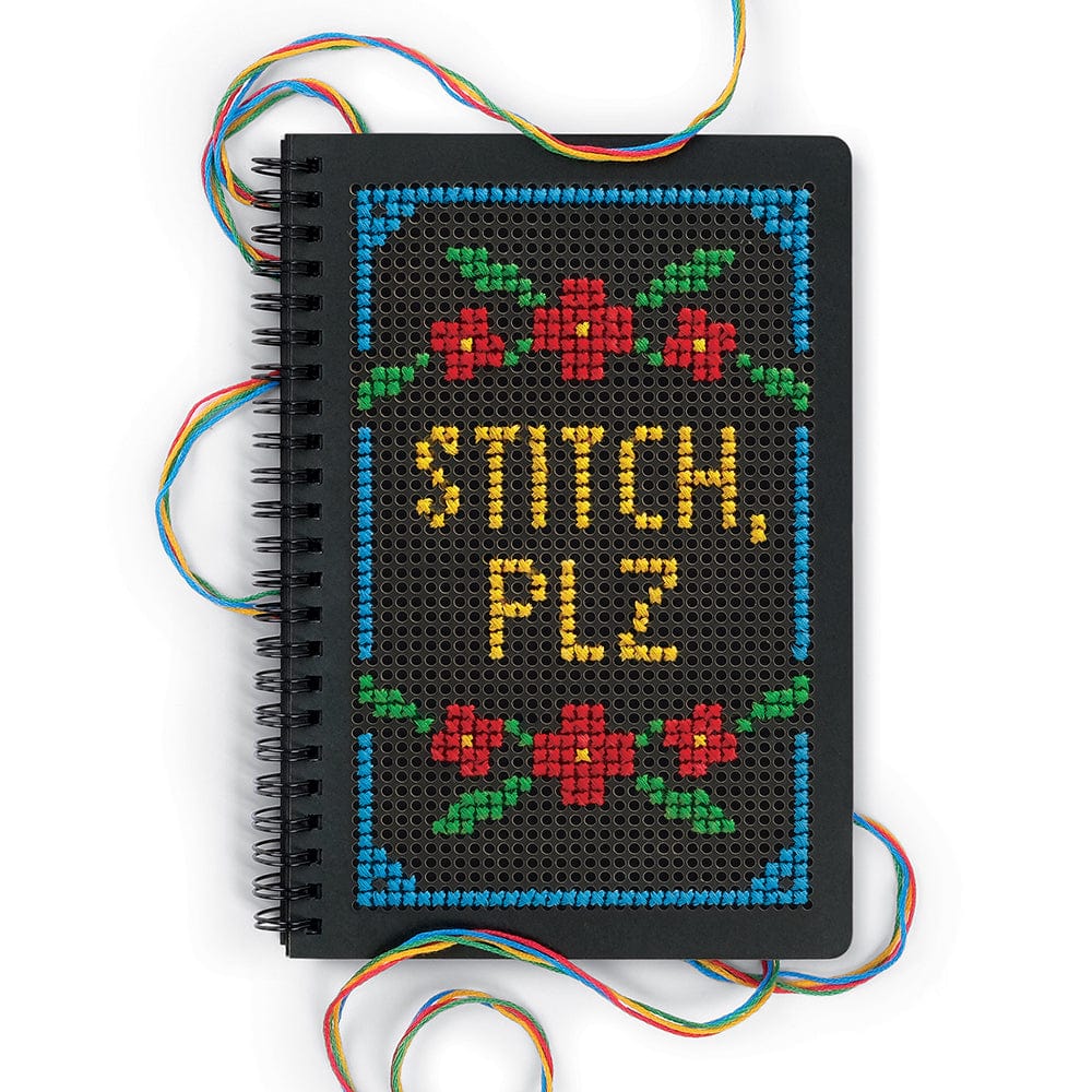 A black journal with a cross stitched cover that says "Stitch, Plz". The journal is surrounded by 4 colors of embroidery thread: blue, green, red, and yellow.